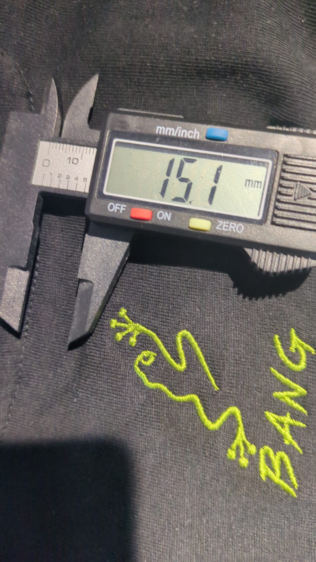 BANG embroidery detail being measured